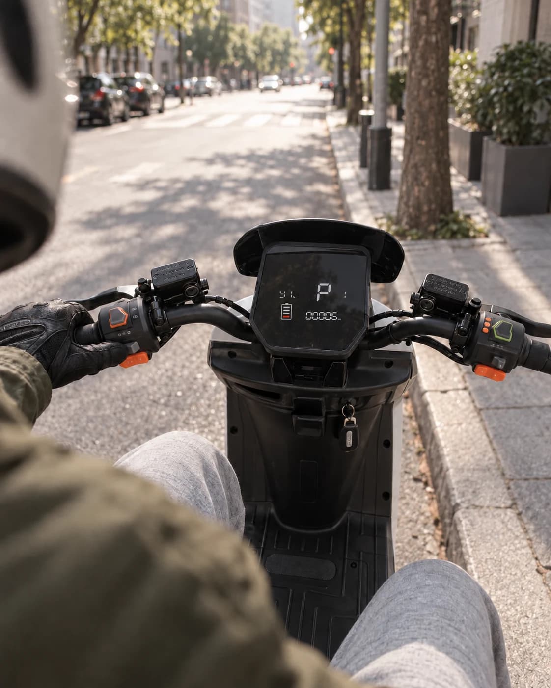 Rider-view of the Freestone handlebar controls and powered-on dashboard